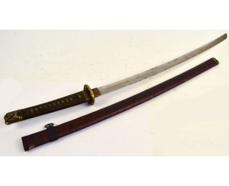 A Japanese katana with shagreen bound grip, floral decorated tsuba, length of blade 63cm, in paper bound scabbard.