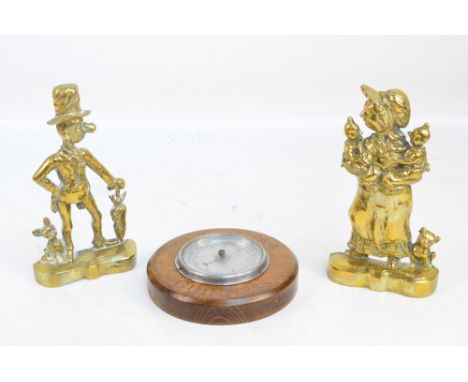 A pair of brass figural door stops, 'Ally Sloper' and 'Mr Sloper', height 28cm, with an oak mounted barometer inscribed 'Love