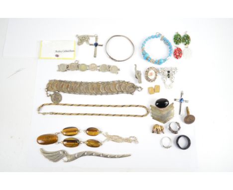 A quantity of silver and white metal jewellery including a 925 silver necklace set with tigers eye, a cabochon oval ruby, etc