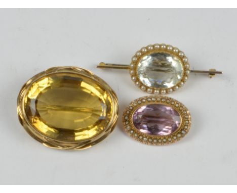 A large late Victorian/Edwardian yellow metal framed oval citrine brooch, width 4.5cm, a 9ct yellow gold framed seed cultured