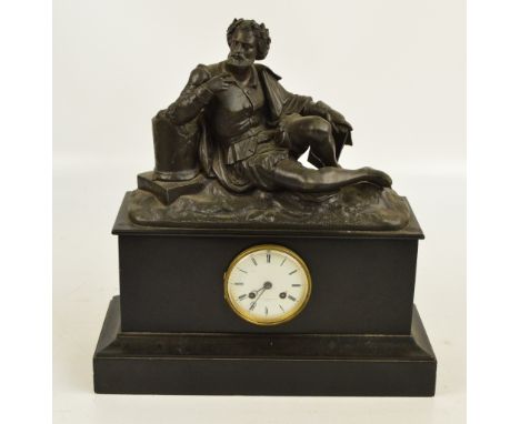A late 19th/early 20th century French black slate mantel clock surmounted with a spelter figure of a recumbent man, the circu