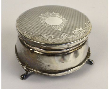 WI BROADWAY & CO; an Elizabeth II hallmarked silver circular jewellery box with engine turned decoration and vacant cartouche