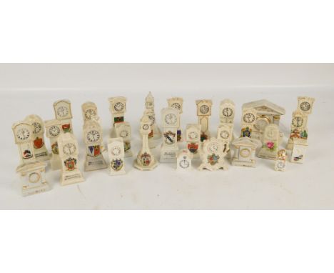 A collection of crested ceramic miniature clocks, mostly longcase clocks including examples by Arcadian, Clifton, Podmore etc