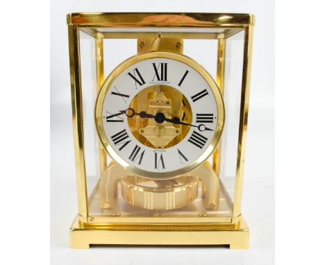 JAEGER-LECOULTRE; a boxed 20th century gilt metal Swiss Atmos clock, model 526, with white enamel chapter ring bearing Roman 