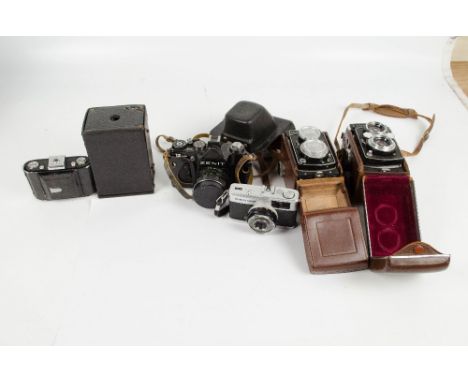 A collection of vintage cameras including a leather cased Rolleicord DBP DBGM, a folding bellows vice Zeiss Ikon, a canvas ca