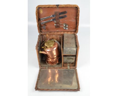 An Edwardian G.W. Scott & Son wicker two person 'En Route' tea basket 'The Continental', metal lined and comprising a copper 