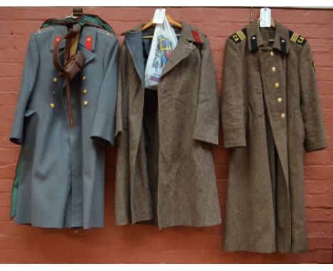 A WWII Russian wool great coat, a further post war great coat with hammer and sickle buttons, marked CA to shoulder epaulette