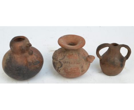 Two Mayan pots, one decorated with a stylised lizard, the second set with a bird and chicks, height 13cm and 14.5cm, believed