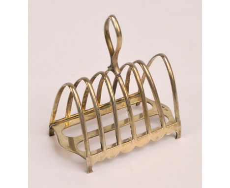 WALKER & HALL; a George VI hallmarked silver six division toast rack with lancet shaped ribs and central loop handle on four 
