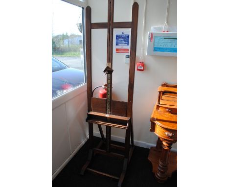 A late Victorian mahogany easel with adjustable brass central rack and square section supports.   CONDITION REPORT:  The wood