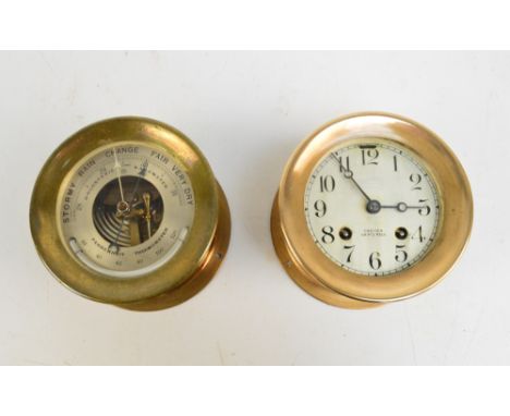 A brass circular ship's wall clock inscribed 'Chelsea Ship's Bell, Chelsea Clock Co, Boston', diameter 14.75cm, and a brass c