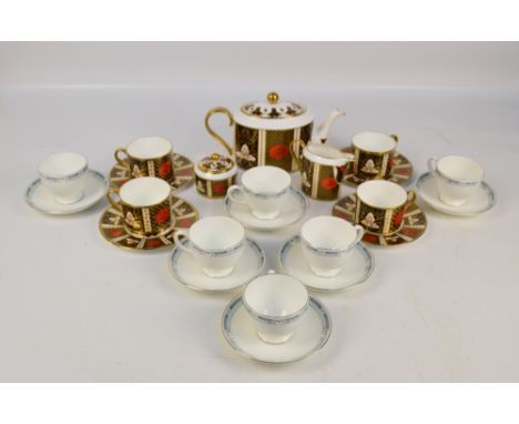 A chrysanthemum Heron Cross Pottery 'Abbeydale' pattern tea set comprising oval teapot, cream jug, sugar box and four cups wi