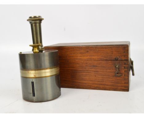 A c.1900 oak cased bi-metallic surveyor's cross with compass.