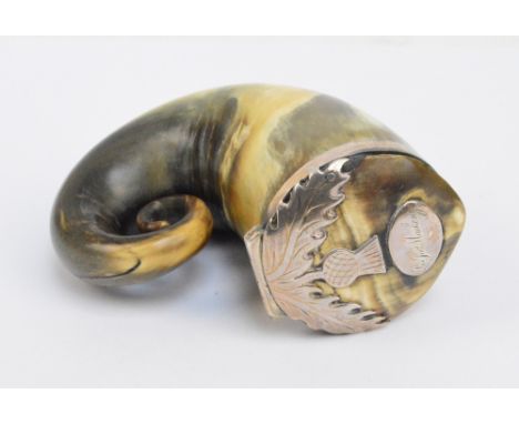 A late 19th/early 20th century Scottish white metal mounted thistle motif decorated horn snuff box with an applied cartouche 