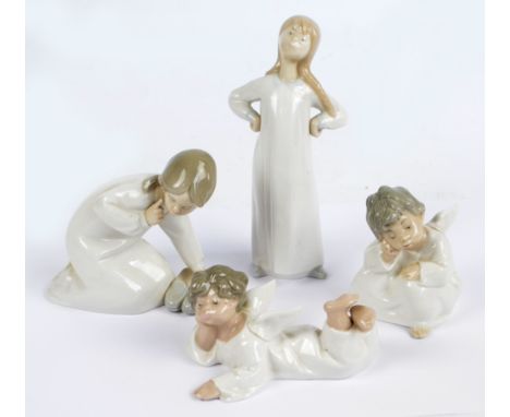 LLADRO; four figures; a girl with shoes, a stretching girl, a seated angel and a lying angel (4).   CONDITION REPORT:  Some s