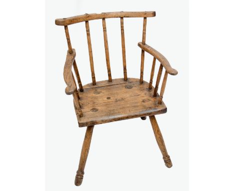 An early 19th century ash and elm primitive stick back elbow chair.   CONDITION REPORT:  Height to top of seat is 41cm.