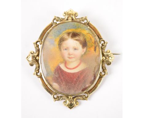 A late 19th century oval miniature on ivory portrait depicting a young girl, glazed to verso, 5 x 4cm, within cast scroll yel