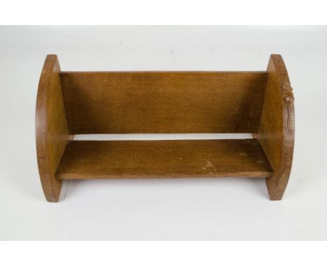 ROBERT 'MOUSEMAN' THOMPSON; an oak book trough with curved ends, one bearing the mouse prominently, width 46cm.   CONDITION R