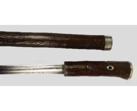 A Regency sword stick with wooden grip and scabbard, white metal mount engraved to the cap with tapering blade, overall lengt