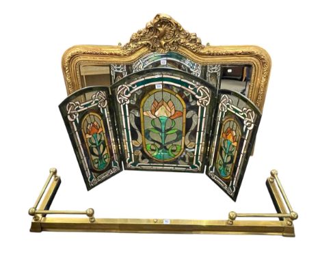 Gilt framed bevelled overmantel mirror, triple leaded glass firescreen and brass extending fender (3).