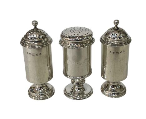 Pair of Scottish Hamilton & Inches silver pepperettes, with reeded borders, Edinburgh 1879,10.5cm, and Hamilton & Co Calcutta