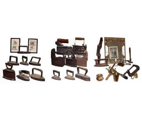 ~ A collection of metalwares, mainly flat irons and box irons, antique leather working tools including Blanchard Paris, pierc