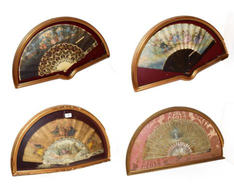 ~ Four fans each in a gilt framed wall hanging display case, comprising two with bone sticks and depicting Watteauesque scene