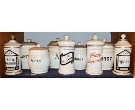 ~ A quantity of Spanish pottery food storage jars and covers with enamel and gilt lettering (1 shelf)