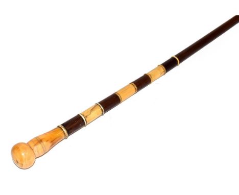 A marine ivory mounted walking stick, 19th century, with baluster turned and ball finials and turned collars, 86cm high