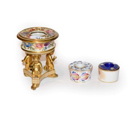 A 19th century Derby figural and floral inkwell, together with two other Derby inkwells