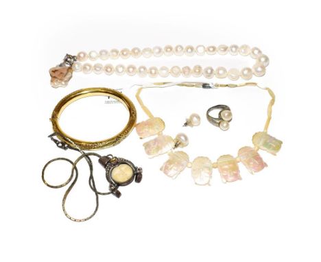 ~ A plated bangle (a.f.); a simulated pearl necklace; a pair of simulated pearl earrings; a simulated pearl ring, finger size