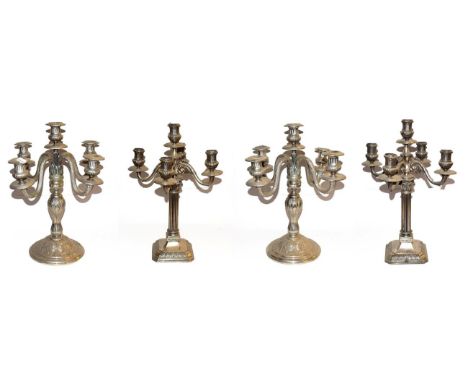 ~ Two pairs of Continental silver plated five branch candelabra, one pair of Corinthian column form and the other decorated w
