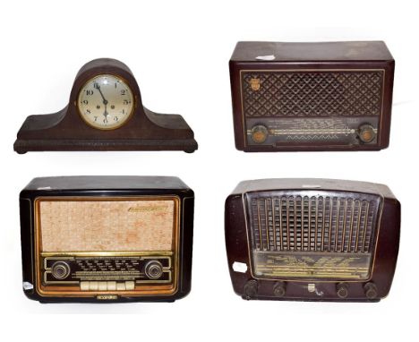 ~ An Invicta Bakelite valve radio, two Philips examples and an oak cased 8 day mantel clock striking on a gong, (4).