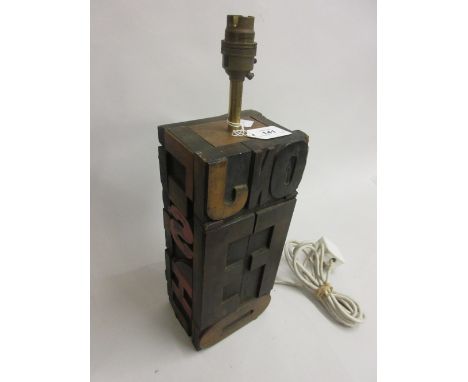 Table lamp base constructed from Printing Press block letters