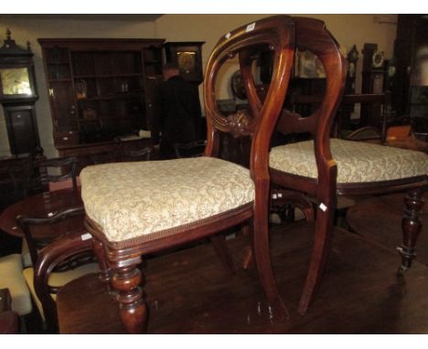 Set of six 19th Century mahogany balloon back dining chairs having carved decoration, overstuffed seats raised on turned tape