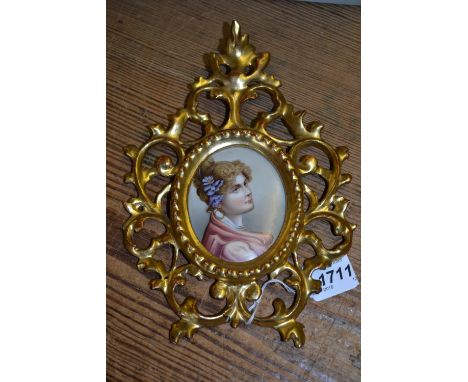 Late 19th Century miniature head and shoulder portrait on porcelain of a lady housed in a gilt Florentine frame, 3ins x 2.5in