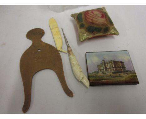 Five various 19th Century needlework items including a glass and velvet pin cushion and an early 20th Century ivory needle ca