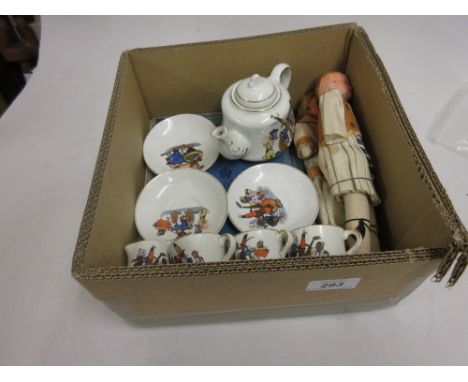 Childrens dolls teaset with transfer printed decoration of African children playing comprising:-  teapot, two cups, two sauce