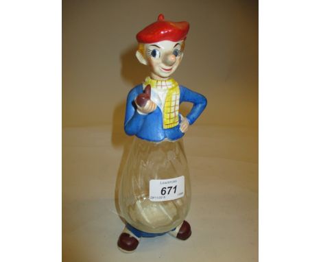 20th Century decanter with novelty ceramic stopper and feet with glass body depicting a man smoking a pipe