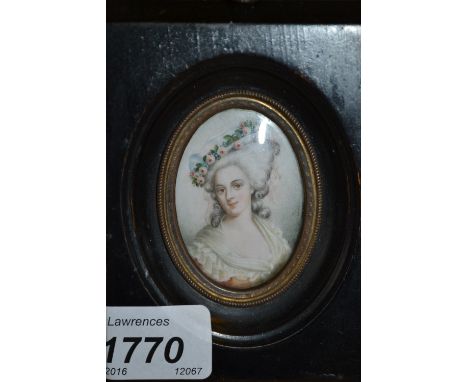 19th Century portrait miniature of a lady wearing a floral decorated hat, ebonised frame