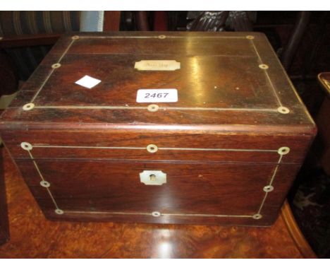 Victorian rosewood and mother of pearl inlaid dressing case, the hinged cover enclosing a fitted interior and concealed side 