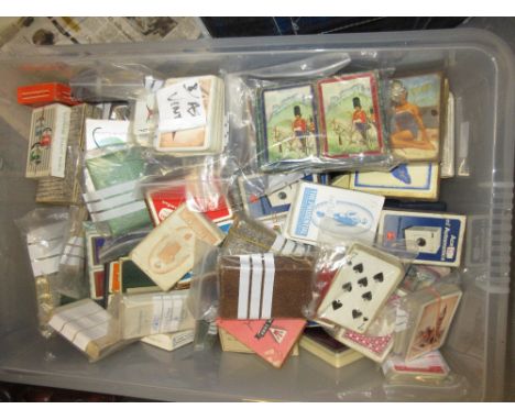 Box containing a quantity of various assorted packs of playing cards