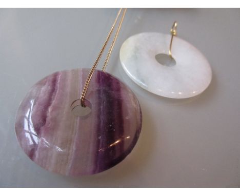 Blue John circular pendant together with a jade pendant
