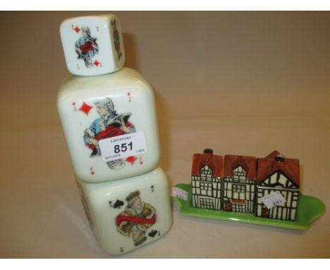 Beswick three piece condiment set on tray in the form of beamed cottages and an opaque glass decanter in the form of cards