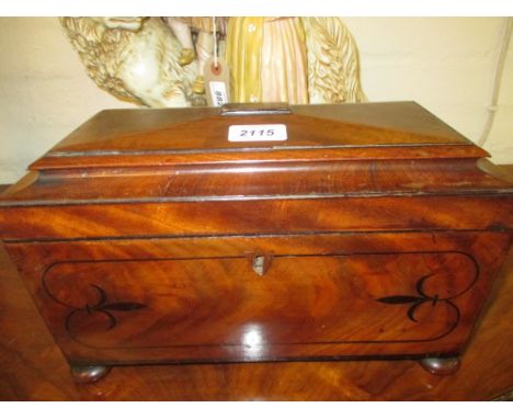 Large 19th Century mahogany sarcophagus shaped and inlaid two division tea caddy on turned bun supports