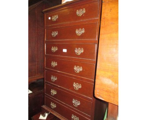 Reproduction mahogany narrow chest of seven drawers with brass swan neck handles and bracket feet