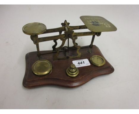 Pair of brass postal scales with weights