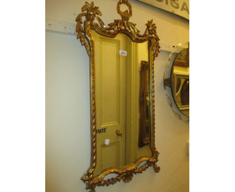 Reproduction giltwood wall mirror and a similar table lamp