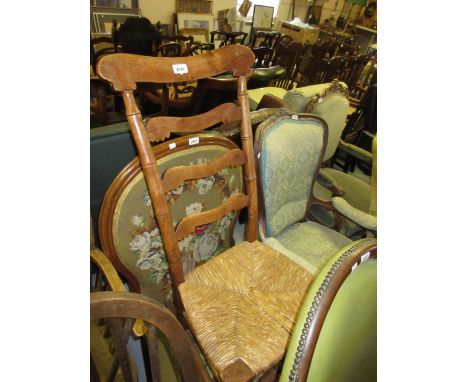 19th Century fruitwood rocking chair with ladder back above a rush seat