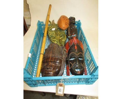 Two African wall masks, carved figure, miniature rugby ball, wooden pot, bamboo cane and a hardwood walking stick